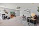 Bright and open living room with a ceiling fan, television, and comfortable seating at 9721 Marmot Ridge Cir, Littleton, CO 80125