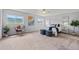 Bright bedroom featuring neutral walls, plush carpet, and serene views from large windows at 9721 Marmot Ridge Cir, Littleton, CO 80125