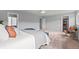 Bedroom featuring cozy carpet, neutral walls, and closet access at 9721 Marmot Ridge Cir, Littleton, CO 80125