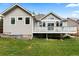 A house's backyard shows off the property's spacious outdoor area and curb appeal at 1901 S Union Pl, Lakewood, CO 80228