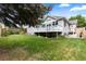 Expansive backyard featuring lush green grass, mature trees, and well-maintained landscaping at 1901 S Union Pl, Lakewood, CO 80228