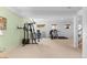 Basement gym features workout equipment, windows, and neutral carpet at 1901 S Union Pl, Lakewood, CO 80228