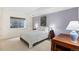 Finished basement bedroom with egress window, carpet, and desk at 1901 S Union Pl, Lakewood, CO 80228
