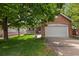 Charming single-Gathering home with a brick facade, two car garage, lawn, and mature shade tree at 1901 S Union Pl, Lakewood, CO 80228