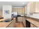 Spacious kitchen featuring stainless steel appliances, granite counters, and hardwood floors at 1901 S Union Pl, Lakewood, CO 80228