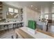 Open-concept dining area featuring a breakfast bar and a seamless flow into the living spaces at 13151 E 103Rd Pl, Commerce City, CO 80022