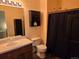 Cozy bathroom with vanity, medicine cabinet, and shower with dark curtain at 2430 W 82Nd Pl # 2F, Westminster, CO 80031