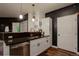 Modern kitchen featuring white cabinetry, stainless steel appliances, and granite countertops at 2430 W 82Nd Pl # 2F, Westminster, CO 80031