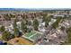 A scenic aerial view of the property featuring tennis courts and mature trees at 2770 S Elmira St # 2, Denver, CO 80231