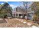 Backyard with stepping stones leading to covered patio on a grey siding home at 2770 S Elmira St # 2, Denver, CO 80231