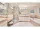 Luxurious bathroom with a glass-enclosed shower and separate bathtub at 2770 S Elmira St # 2, Denver, CO 80231