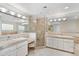 Large bathroom featuring marble countertops, double sinks, and glass-enclosed shower at 2770 S Elmira St # 2, Denver, CO 80231