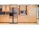 Well-designed kitchen with stainless steel refrigerator and built-in microwave at 2770 S Elmira St # 2, Denver, CO 80231