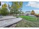The backyard has a stamped concrete patio and lush green grass at 5109 S Malta Way, Centennial, CO 80015