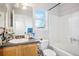 Clean bathroom featuring window and shower-tub combo at 5109 S Malta Way, Centennial, CO 80015
