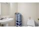 Neutral bathroom featuring pedestal sink and commode at 5109 S Malta Way, Centennial, CO 80015