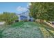 Charming blue two-story home with a well-maintained front yard and mature trees at 5109 S Malta Way, Centennial, CO 80015