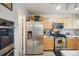Well-equipped kitchen with modern appliances and plenty of cabinet storage at 5109 S Malta Way, Centennial, CO 80015
