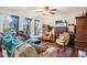 Bright living room with large windows, hardwood floors, and comfortable seating at 5109 S Malta Way, Centennial, CO 80015