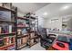 Basement featuring shelving and a work area with a daybed in a neutral color palette at 3881 Zenobia St, Denver, CO 80212