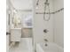 Bright bathroom featuring a shower over tub and modern vanity and fixtures at 3881 Zenobia St, Denver, CO 80212