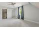 Neutral bedroom featuring an ample closet, a window with natural light and neutral colored carpet at 3881 Zenobia St, Denver, CO 80212