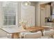 Bright dining room featuring wooden table, modern pendant lighting, and minimalist decor at 3881 Zenobia St, Denver, CO 80212