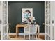 Close up of the staging of an elegant home office with stylish decor, furniture, and hardwood flooring at 3881 Zenobia St, Denver, CO 80212