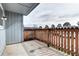 Balcony with wooden railing, views of the sky and nearby street at 7260 S Gaylord St # E26, Littleton, CO 80122
