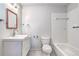 This bathroom features a white vanity, stylish mirror, and a shower-tub combination at 7260 S Gaylord St # E26, Littleton, CO 80122