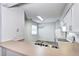 Kitchen featuring a stainless steel sink, lots of lighting and bar seating area at 7260 S Gaylord St # E26, Littleton, CO 80122