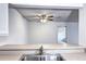 Bright kitchen view from countertop to living space, featuring stainless steel sink at 7260 S Gaylord St # E26, Littleton, CO 80122