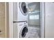 This unit features a stackable washer and dryer inside the bathroom at 7260 S Gaylord St # E26, Littleton, CO 80122
