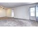 Bright living room featuring neutral walls, ceiling fan, and plush carpeting at 7260 S Gaylord St # E26, Littleton, CO 80122