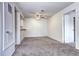 Inviting living room with ceiling fan, neutral tones, and plush carpeting at 7260 S Gaylord St # E26, Littleton, CO 80122