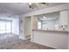 Open living room and kitchen area featuring lots of natural light at 7260 S Gaylord St # E26, Littleton, CO 80122