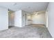 Bright living room shows neutral carpet, white walls, and ceiling fan at 7260 S Gaylord St # E26, Littleton, CO 80122