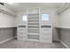 Walk-in closet with custom built-in shelving, drawers, and ample hanging space at 3041 Starling Ct, Castle Rock, CO 80109