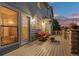 Charming deck with wicker furniture and stone pillars, offering a cozy outdoor space for relaxation at 3041 Starling Ct, Castle Rock, CO 80109