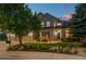 Charming home exterior featuring a well-manicured lawn, mature trees, and a welcoming entrance at 3041 Starling Ct, Castle Rock, CO 80109