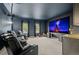 Enjoy movies in this luxury home theater with tiered seating and a massive screen at 3041 Starling Ct, Castle Rock, CO 80109