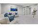 Bright and airy living room features a large sectional, built-in bookshelves, and a view of the bar area at 3041 Starling Ct, Castle Rock, CO 80109
