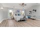 Bright and airy main bedroom features large windows, elegant furnishings, and modern decor at 3041 Starling Ct, Castle Rock, CO 80109