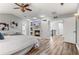 Spacious main bedroom features a cozy fireplace, mounted TV, and easy access to the hallway at 3041 Starling Ct, Castle Rock, CO 80109