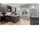 Home office includes a large desk area, built-in shelving, and a window with outside views at 3041 Starling Ct, Castle Rock, CO 80109