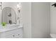 Modern powder room features a vessel sink, sleek faucet, and elegant vanity at 3041 Starling Ct, Castle Rock, CO 80109