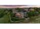 Aerial view of a home with a large backyard, a deck, a patio, and mature trees at 3041 Starling Ct, Castle Rock, CO 80109