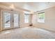 Finished basement with carpet, recessed lights, and a glass patio door at 2561 Cactus Bluff Pl, Highlands Ranch, CO 80129
