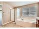 Bathroom featuring a separate shower and a soaking tub at 2561 Cactus Bluff Pl, Highlands Ranch, CO 80129