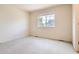 Bedroom with a window and carpeted floor at 2561 Cactus Bluff Pl, Highlands Ranch, CO 80129